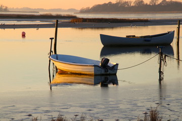 Dinghies on quiet sea in February