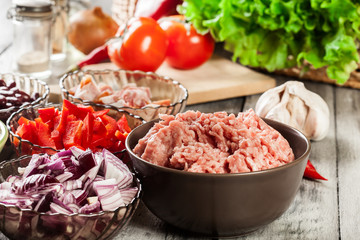 Ingredients ready for preparing chili con carne. Mincemeat, papr