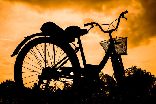 landscape image beautiful with Silhouette vintage Bicycle at sunset