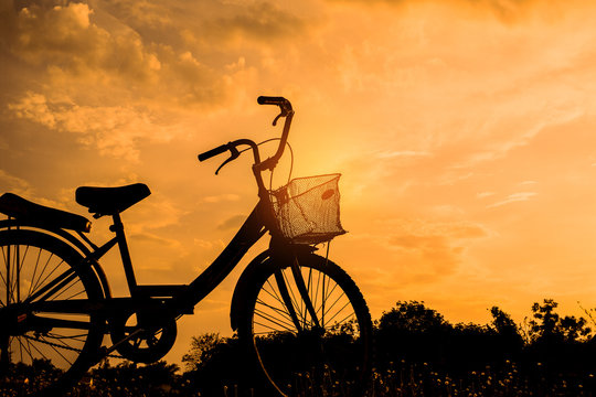 landscape image beautiful with Silhouette vintage Bicycle at sunset