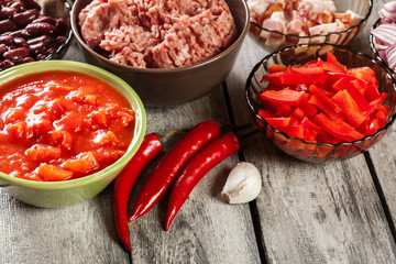 Ingredients ready for preparing chili con carne. Mincemeat, papr