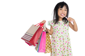Asian chinese little girl with shopping bags