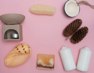 Aromatherapy  product  Spa set ,candle ,soap,coconut,flower,shell,  massage  with  pink color   background .