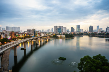Fototapeta premium Aerial skyline view of Hanoi. Hanoi cityscape at twilight at Hoang Cau lake