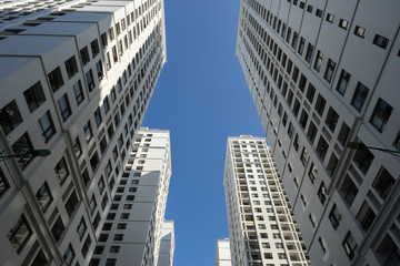 Obraz premium Resident apartment buildings against blue sky