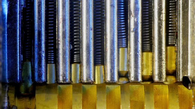 Padlock mechanism block. Shows internal lock springs and key turn. Extreme close up.