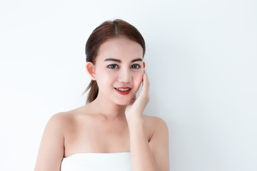 Closeup portrait of asian woman touching face skincare on white background