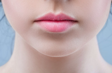 Beauty. Beautiful Woman Face With soft color Lipstick. Sexy Full Lips. Horizontal Portrait Of Female Model With art Makeup. Closeup Of girl Face With Soft Skin. Cosmetics Concept. Skincare concept
