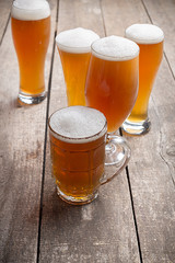glass beer on wood background