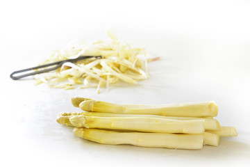 white asparagus and peel in the bright background, copy space