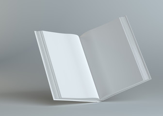 White empty open book on gray background