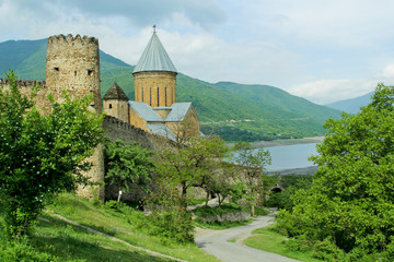 Ananuri church and castle complex panorama on the Aragvi River in Georgia. Turquoise water surface...