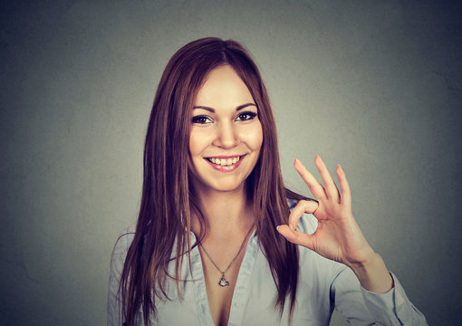 Happy woman showing ok sign