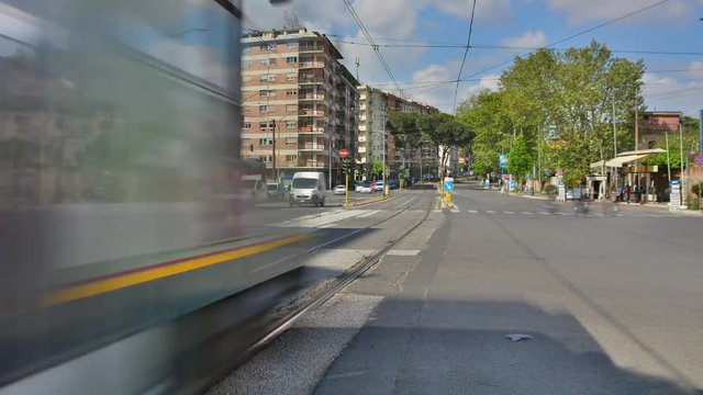 Time Lapse: traffic at a road junction by car, tram, bikes and pedestrians.