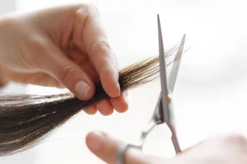 Fotobehang Woman does a haircut © fotofabrika