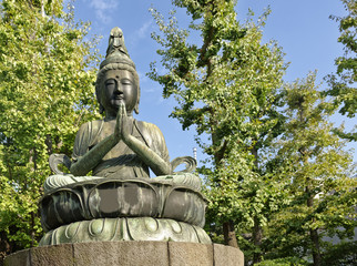 Fototapeta na wymiar Buddha statue in the popular Asakusa Kannon Buddhist temple in Tokyo, Japan