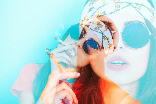 Double exposure of hippy girl smoking weed while wearing sunglasses