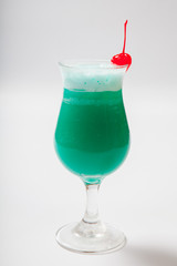 blue Hawaiian cocktail with a cherry. White background