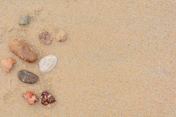 Fototapeta na wymiar Rock on sand background