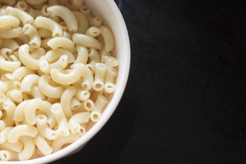 Macaroni in Bowl  on Black Background.