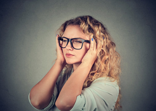 sad woman with worried stressed face expression looking overwhelmed