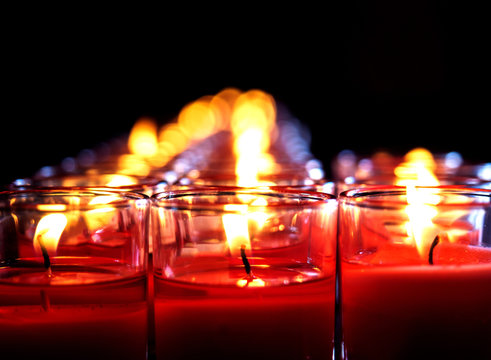 The Red Candle Burns In The Glass.