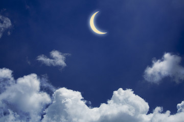Obraz na płótnie Canvas Moon in cloudy night with blue sky background