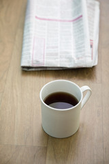 Tea over newspaper