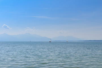 Sailing boats on Lake Chiemsee, Bavaria on a sunny spring day