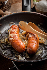 Fried sausage with onions.