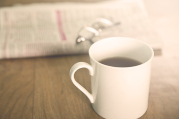 Tea over newspaper