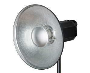 Beauty dish reflector and studio light isolated on white background