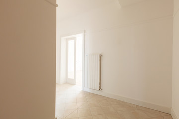 Empty white corner of an old apartment