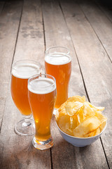 glass beer on wood background