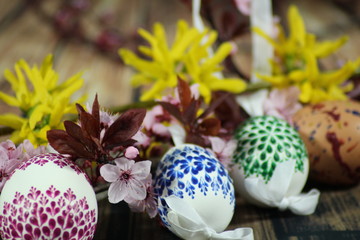 Painted Easter eggs and grass with cherry branch/ Easter eggs and cherry branch.