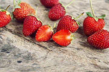close-up of appetizing strawberries on wooden table.