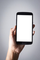 Smartphone in woman hand, white screen.