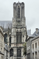 Fototapeta na wymiar Gothic tower, medieval cathedral in Reims, France.