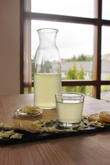 Ginger tea with slices of ginger and lemon and grated ginger root
