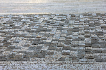 Ancient roman dilapidated small square stone paving in Rimini