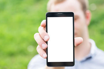Young man showing a mobile phone application
