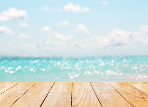 Wooden table top on blue sea