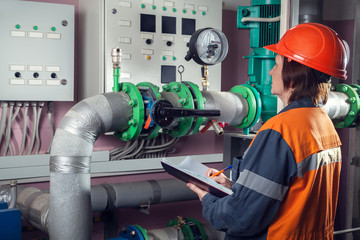 Fototapeta premium Female worker in pumping room