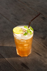 Iced lemon tea on wood table.