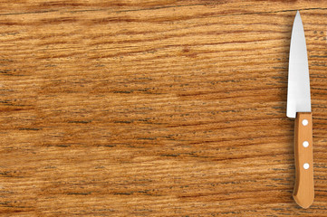 knife on cutting board isolated on white background