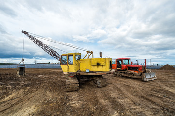 Excavator and tractor