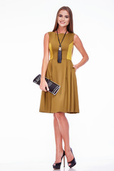 Beautiful sexy woman pretty face makeup wear fashion style clothes yellow wool dress accessory lather bag and shoes code glamour model office long brunette hair catalog trendy design