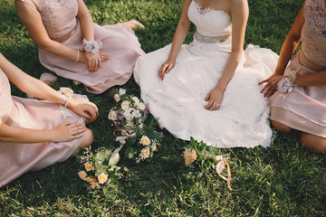 Bride and bridesmaids on grass