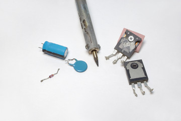 Fototapeta premium Set of electronics: transistors, capacitors, diode and soldering tip