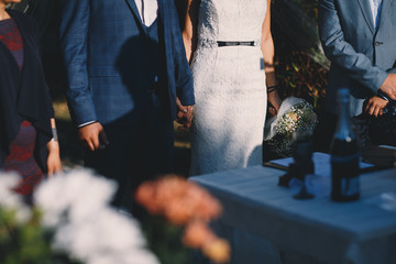 Bride and groom holding hands